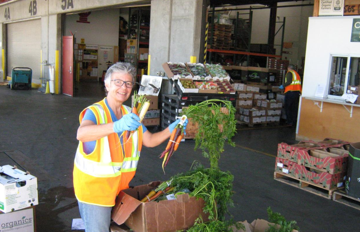 Carolyn Lasar from SF Market holding recovered produce